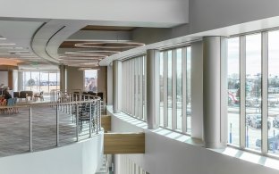 A bright hallway with large windows 