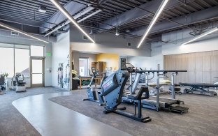 A room with various gym/physical therapy equipment