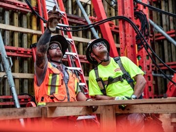 People inspecting a building. 