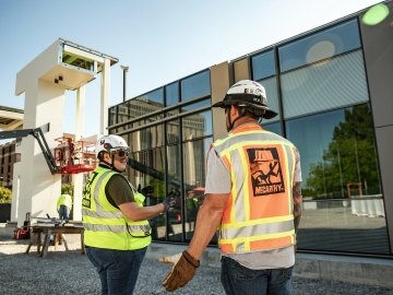 Employees talking about a mock-up