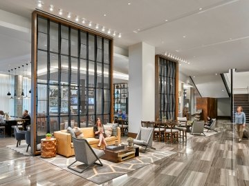 People sitting in the lobby of the Hyatt Regency Hotel.