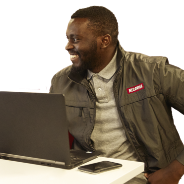 employee sitting at desk with computer