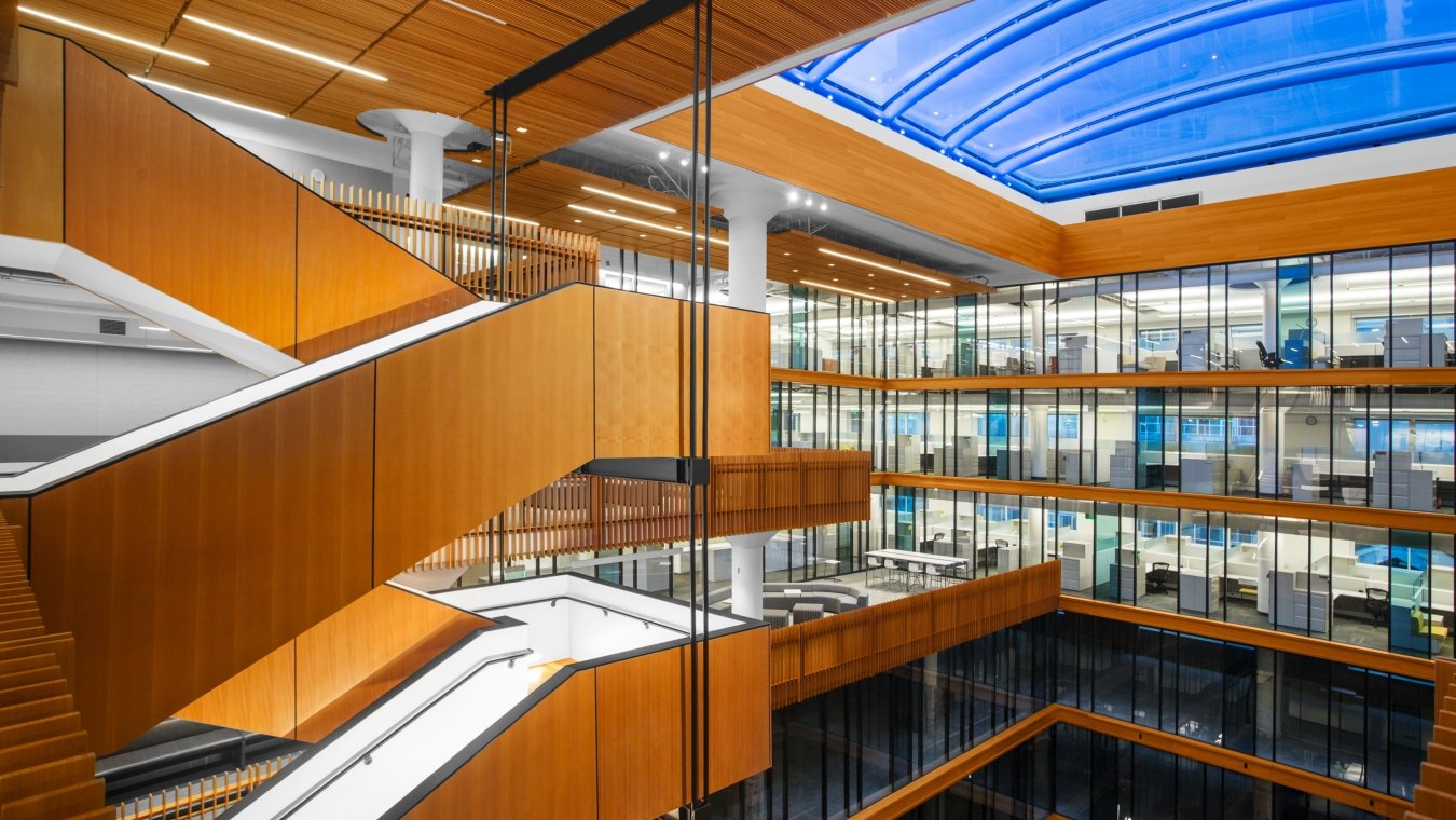 Staircase overlooking several floors of offices. 