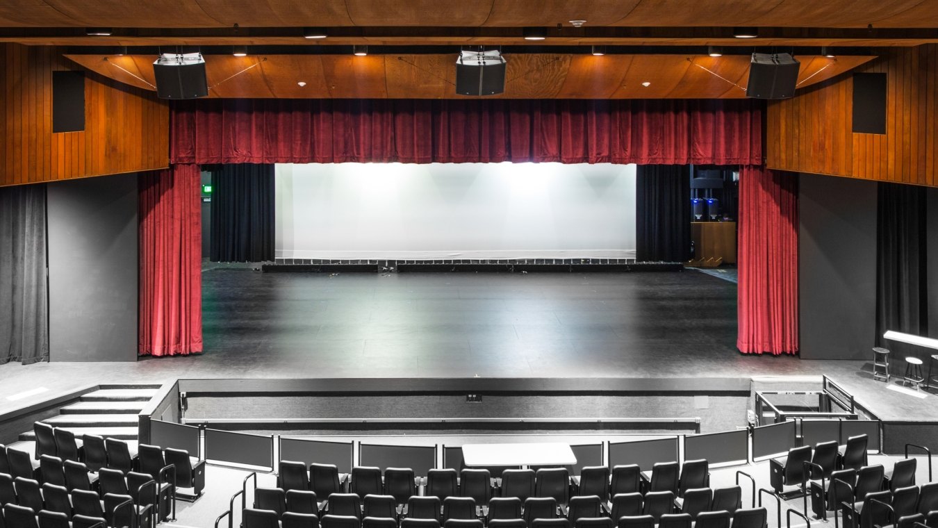 A performance hall with a stage and theater seating.