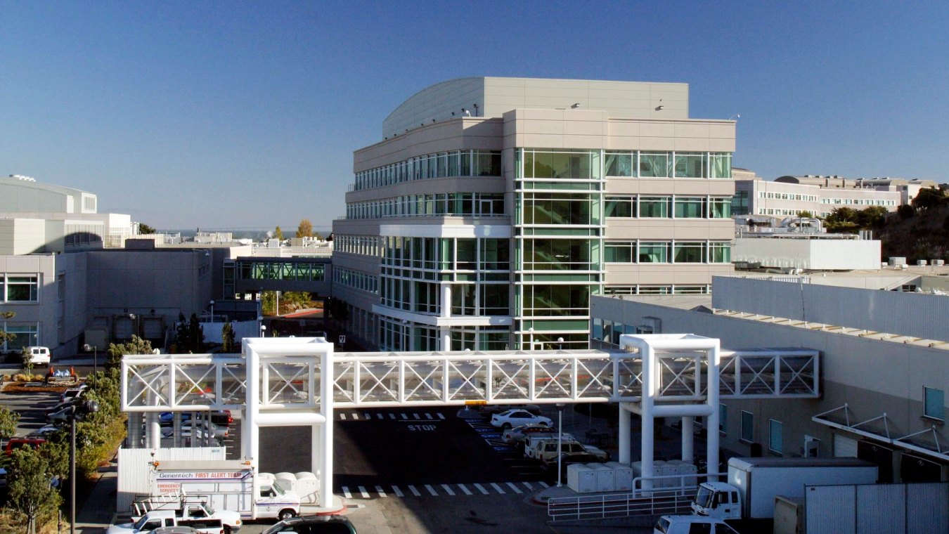 Exterior view of a building with a walkway in front. 