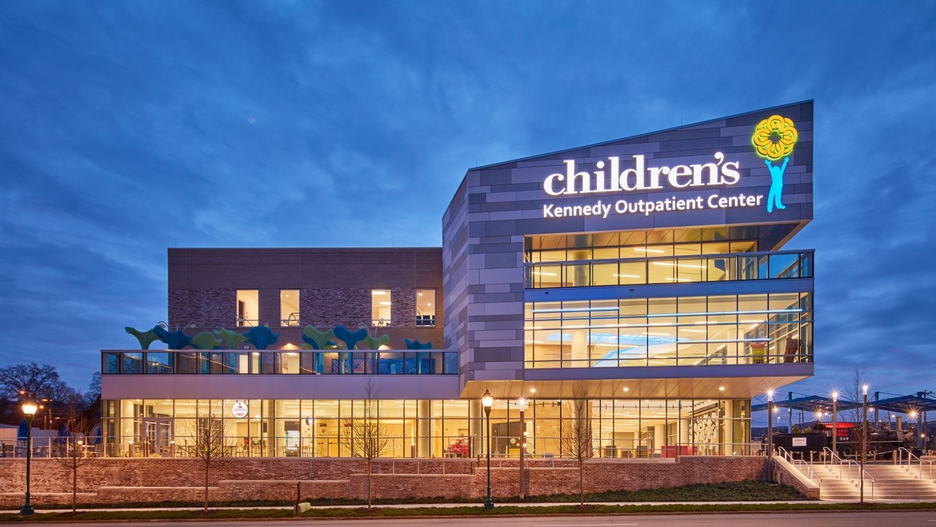 A brilliant exterior view of the Children's Hospital Outpatient Center at dusk.