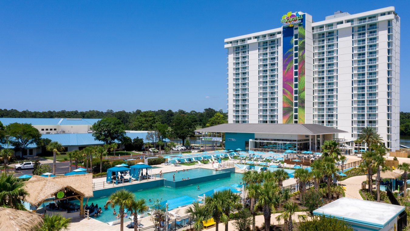Exterior view of the resort tower with the pool in the foreground 