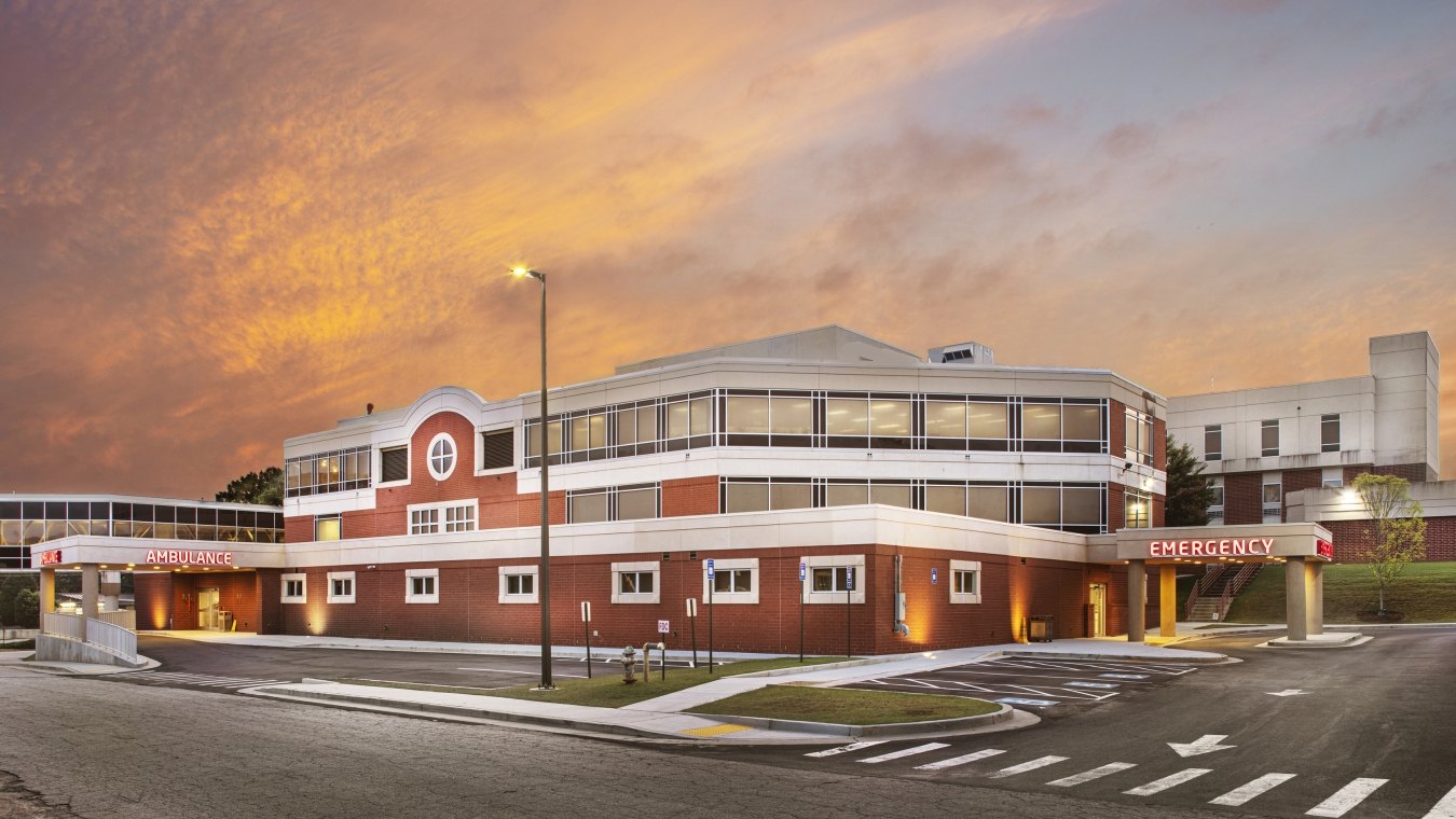 Piedmont Hospital in Newton exterior view at dusk.