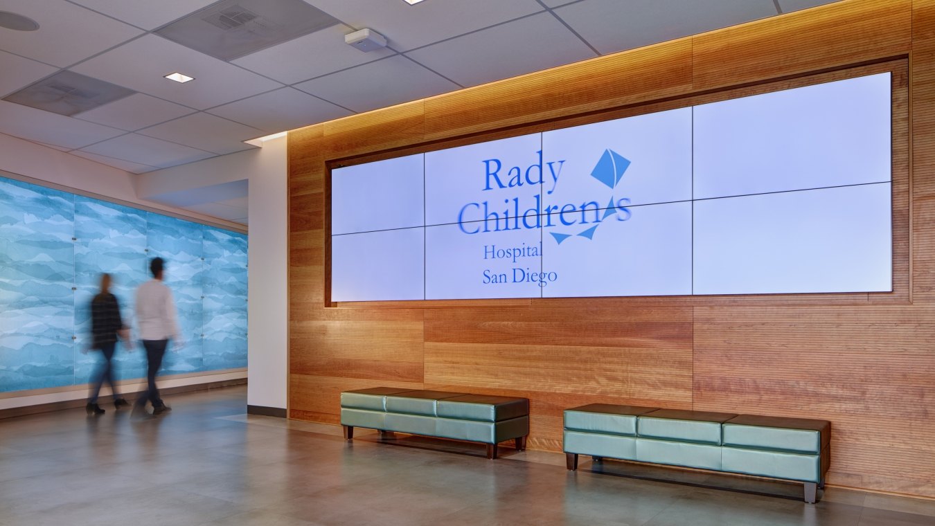 Large video screen on lobby wall in Rady Children’s Hospital Administrative Building and Conference Center 
