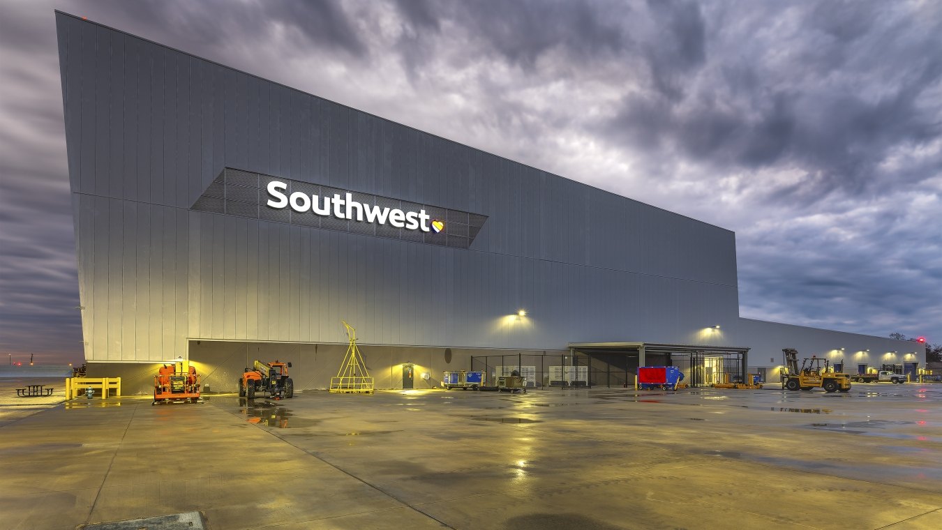 Exterior view of the hangar at nighttime with Southwest sign