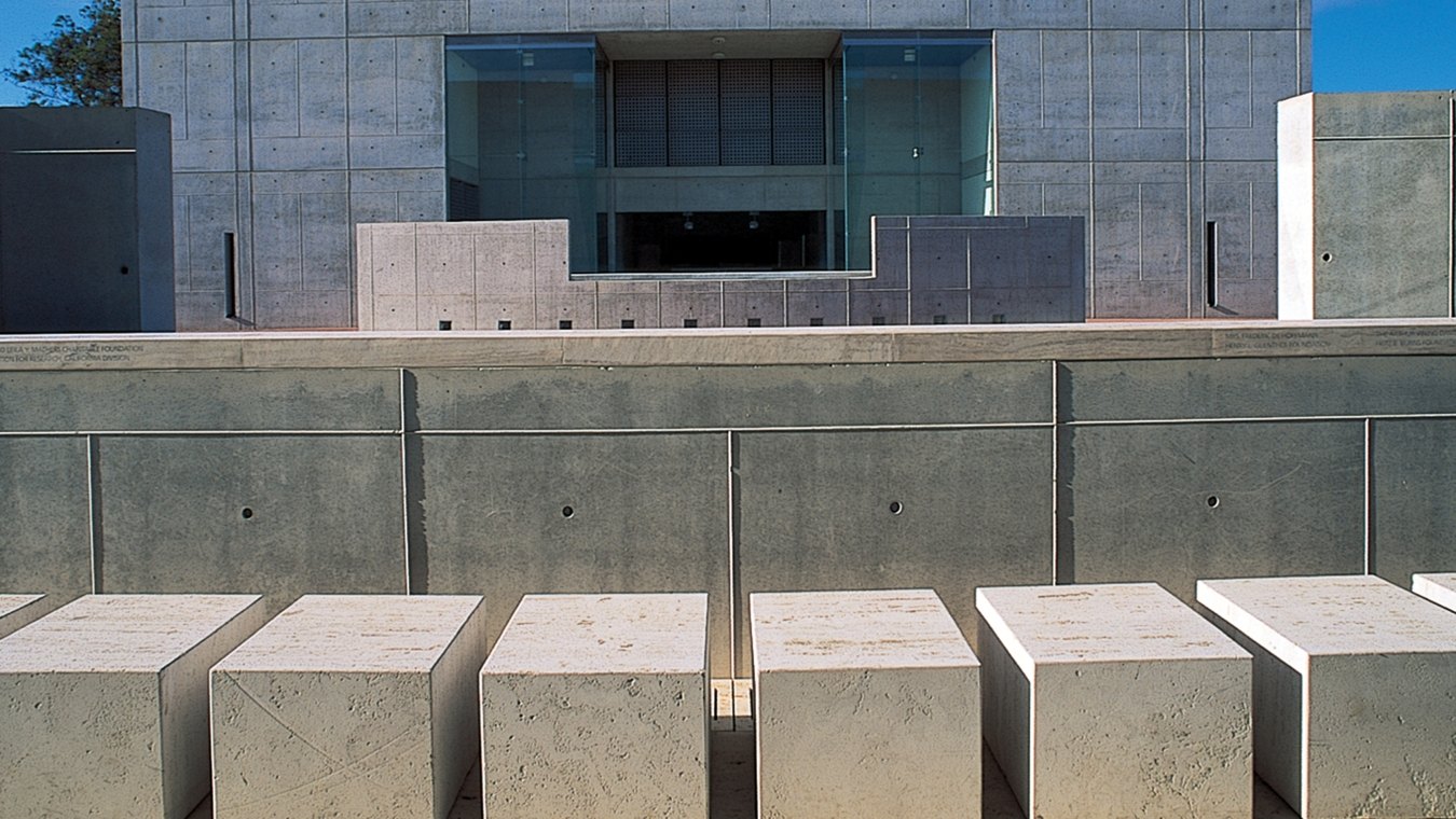 Outdoor entrance to the building that is all concrete