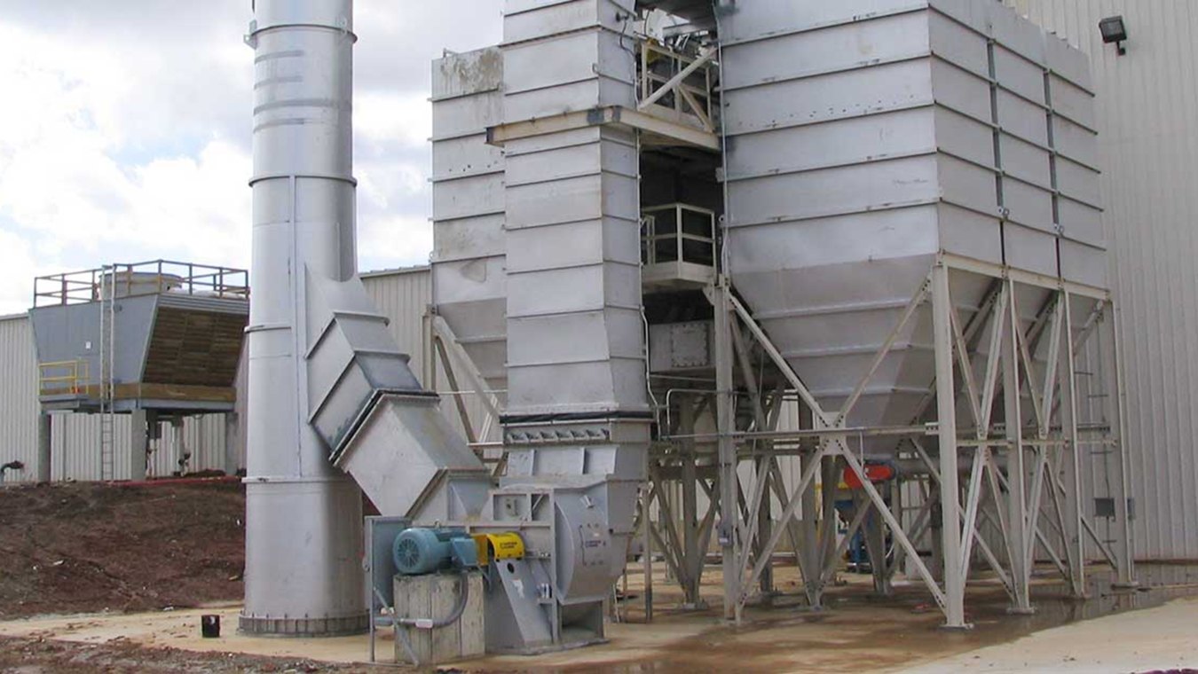 Outdoor image of the recycling plant with a metal tube