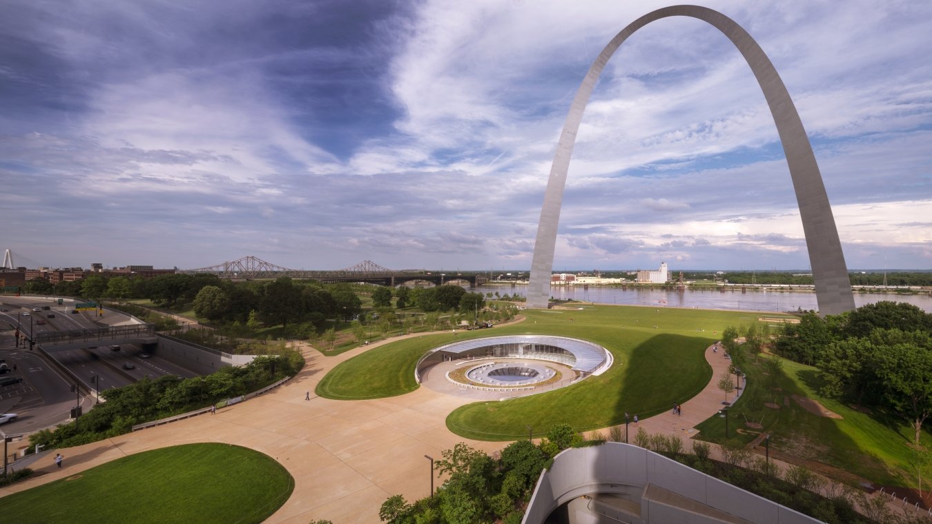 view of the st louis arch, visitor center, and skyline