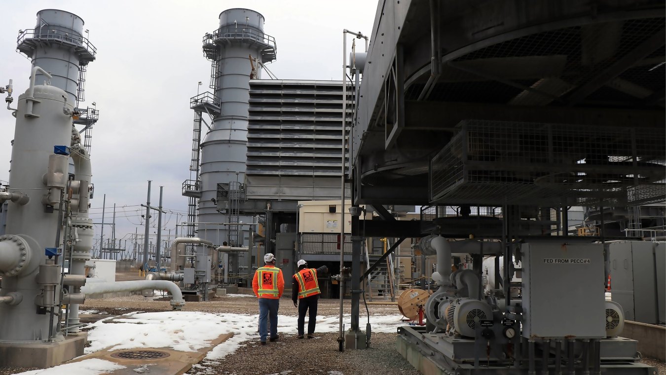 Two people walking on the Ameren Audrain project