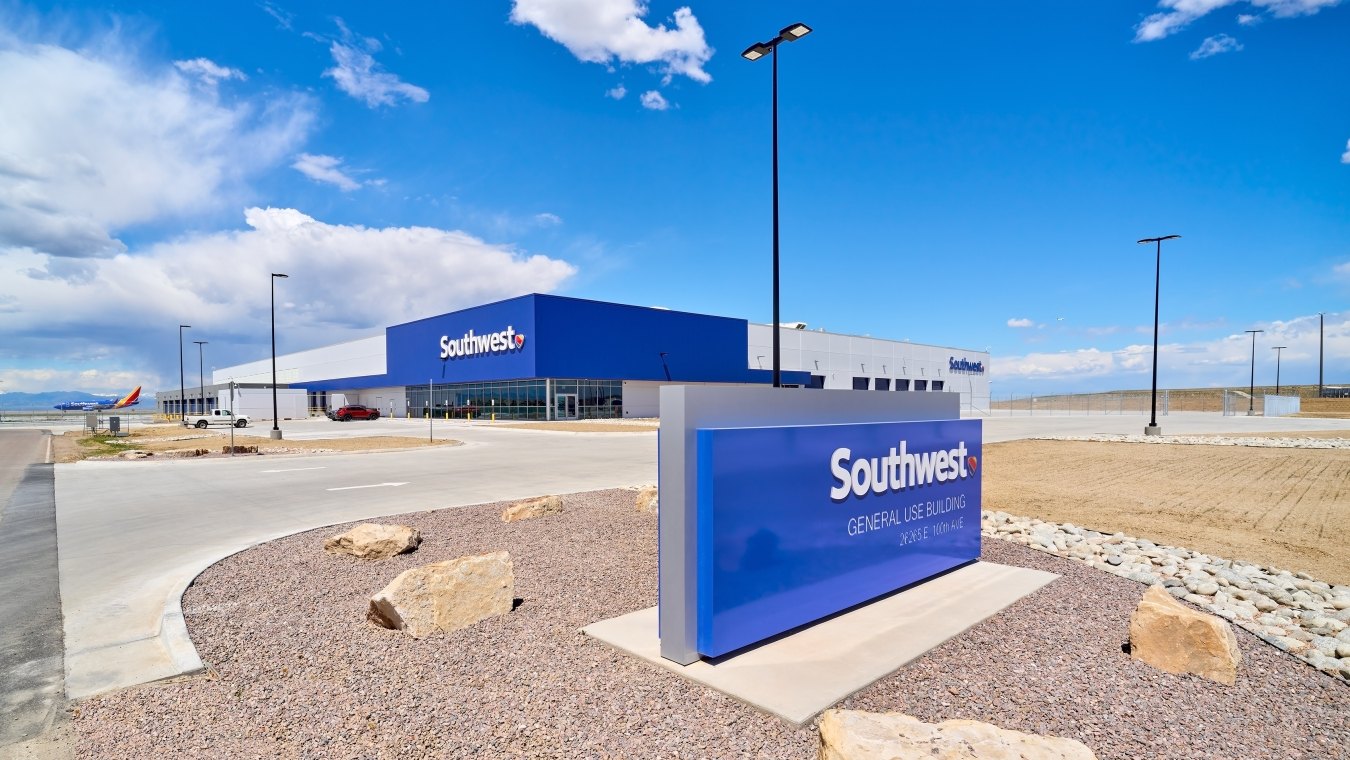 Image of the exterior of the building and a Southwest Airlines sign in the foreground.