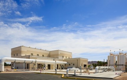 Exterior view of a building with pipes in front of it