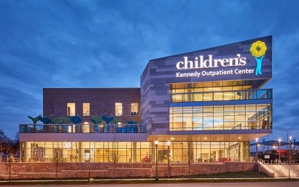 A brilliant exterior view of the Children's Hospital Outpatient Center at dusk.