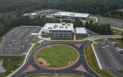 Exterior aerial view of the Carroll Campus building and landscaping. 