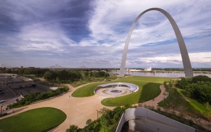 view of the st louis arch, visitor center, and skyline