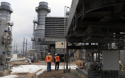 Two people walking on the Ameren Audrain project