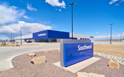 Image of the exterior of the building and a Southwest Airlines sign in the foreground.