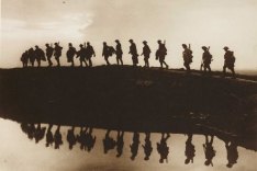 Soldiers walking in a line.