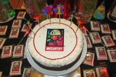 A birthday cake with the McCarthy logo on it.