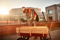 Person assembling a wagon.