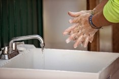 A person washing their hands