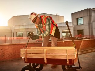 Person building wagon for children.