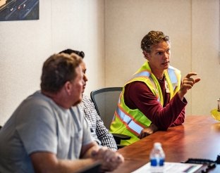 People talking in a meeting.