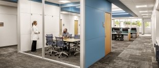 Two people talking in an office