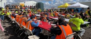 Construction workers having lunch at a jobsite.