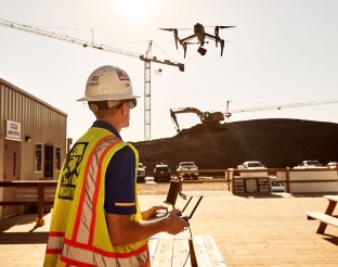 Person piloting drone.