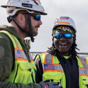 Two people talking on the jobsite