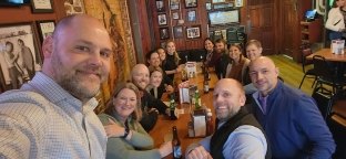 Elizabeth and her team at a table.