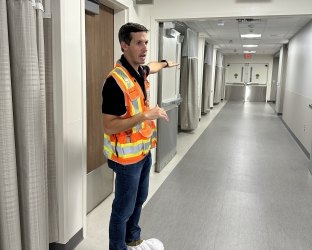 Kris Mannen giving a tour of BJC HealthCare's Plaza West Tower at Barnes-Jewish Hospital in St. Louis.