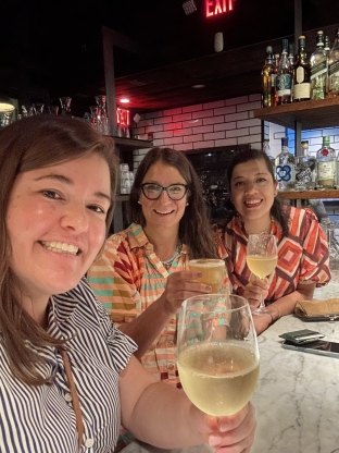Three people sitting at a table