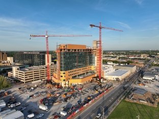 An exterior, aerial shot of the hospital building under construction.