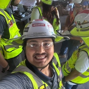 A selfie of a person wearing PPE
