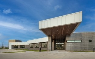 Exterior view of the medical facility with a roof overhang