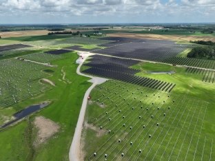 Aerial view of a field with solar panels