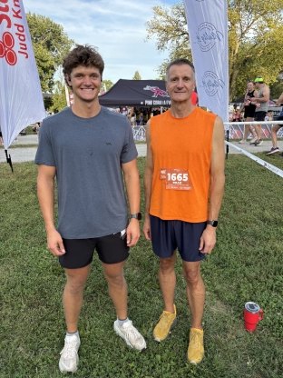 Brad with his son Luke at the Harvest Moon Hustle 10K race