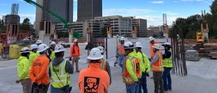 A group of people standing together on a jobsite 