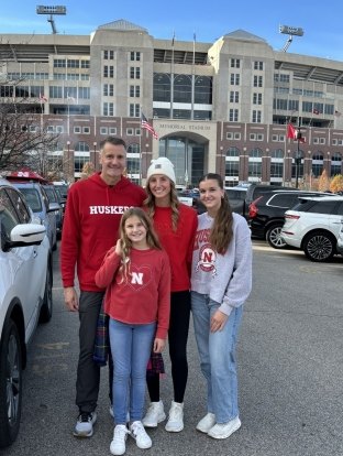 Brad with his daughters at a University of Nebraska-Lincoln Cornhuskers football game