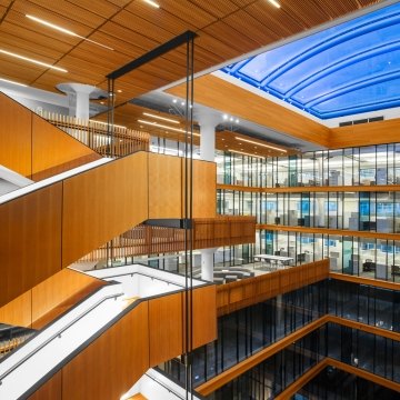 Staircase overlooking several floors of offices. 