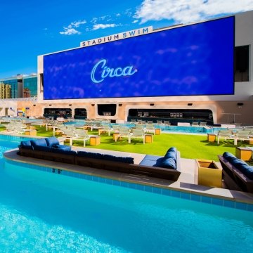 Rooftop swimming pool with a large screen reading "Circa"