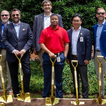 People with shovels at groundbreaking event