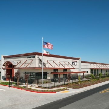 San Joaquin Regional Transit District Bus Maintenance, Fueling and Wash Station Exterior with US Flag