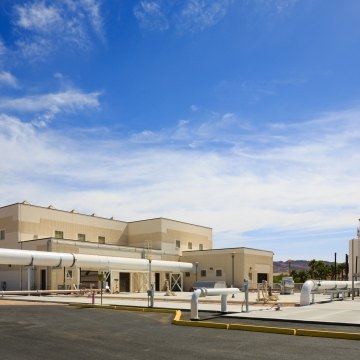 Exterior view of a building with pipes in front of it